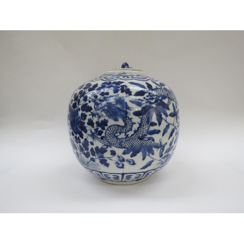 6009 - A Chinese blue and white lidded bulbous jar with double dragon detail with four claws, blue four cha... 