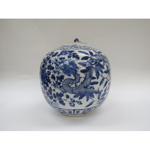 6009 - A Chinese blue and white lidded bulbous jar with double dragon detail with four claws, blue four cha... 