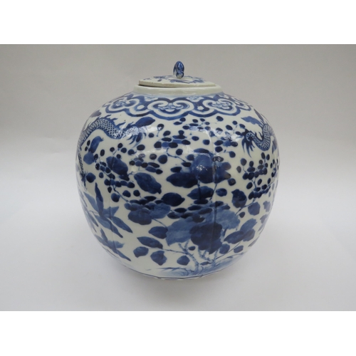 6009 - A Chinese blue and white lidded bulbous jar with double dragon detail with four claws, blue four cha... 