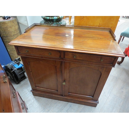 6080 - A late George III rosewood side cabinet the pierced brass three quarter gallery with ivory inlaid to... 