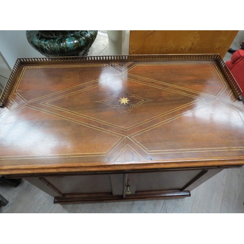 6080 - A late George III rosewood side cabinet the pierced brass three quarter gallery with ivory inlaid to... 