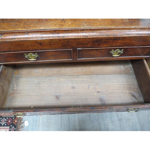 6089 - An early Georgian country oak chest of two short over two long drawers, brass fretwork handles (repl... 