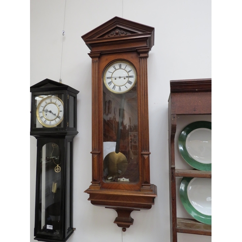 6093 - A late 19th Century walnut cased Vienna regulator wall clock with two train movement striking on a c... 