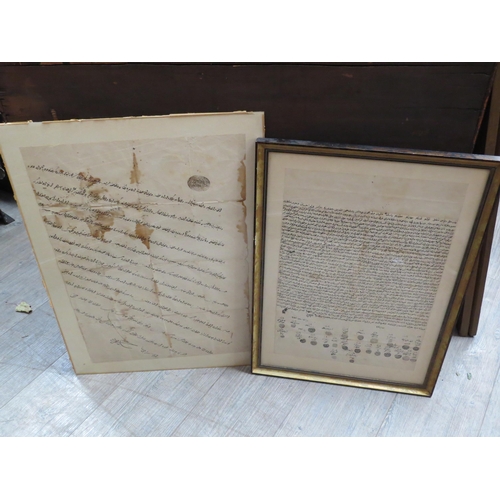 6094 - Two framed pieces of parchment with Arabic and Persian script