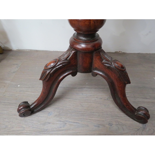 6102 - A Georgian oak occasional table with circular top over turned stem to tripod scroll foot base.  71.5... 