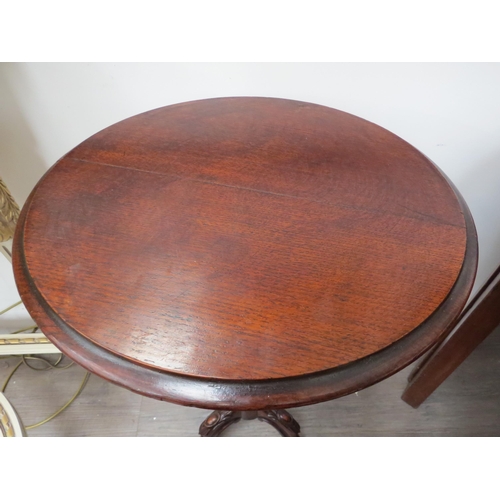 6102 - A Georgian oak occasional table with circular top over turned stem to tripod scroll foot base.  71.5... 