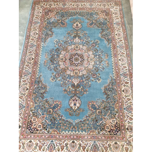 2254 - A blue and pink persian rug 230 x 150cm