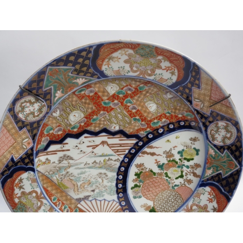 6254 - A Japanese large charger decorated with mount Fuji, 46cm diameter