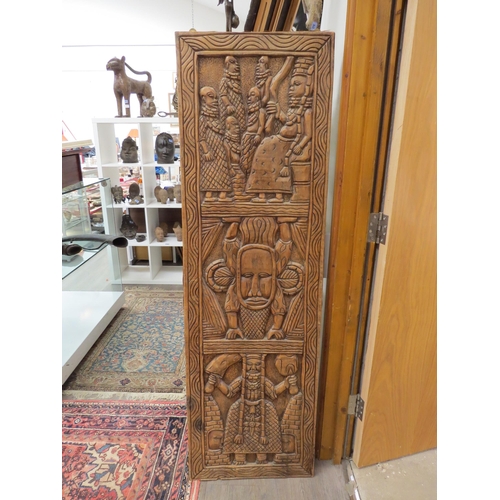 6288 - An African carved wood tall panel 166cm x 50cm