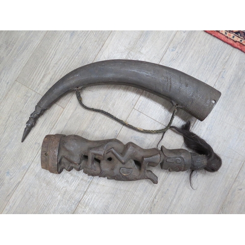 6321 - A large late 19th Century African Naga Morsarang (medicine horn), the horn with figure carved to tip... 