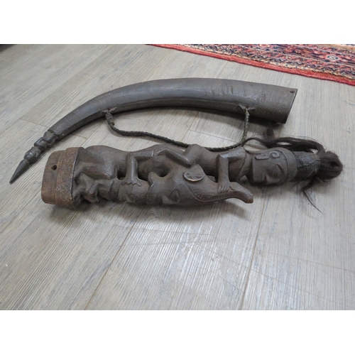 6321 - A large late 19th Century African Naga Morsarang (medicine horn), the horn with figure carved to tip... 