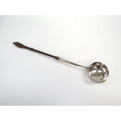 6340 - A 19th Century silver toddy ladle, silver bowl and part of shaft joining a turned fruitwood handle, ... 