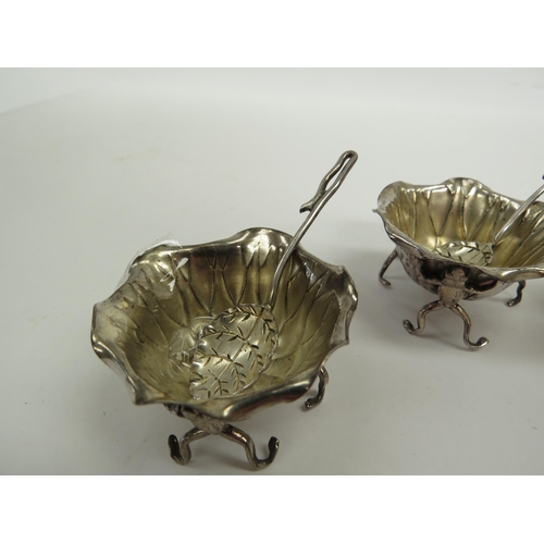 6352 - A set of four silver salts as frogs (one has a leg missing) holding lily pads aloft, maker AW, Birmi... 