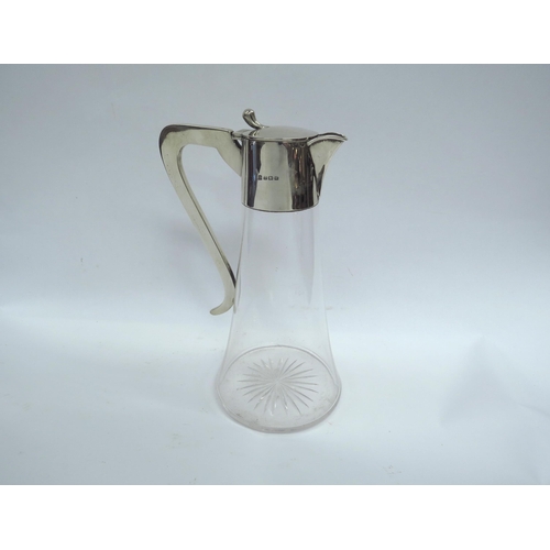 6376 - A Martin Hall & Co Ltd silver claret jug, stirrup handle, plain top, Birmingham 1938, 25cm high