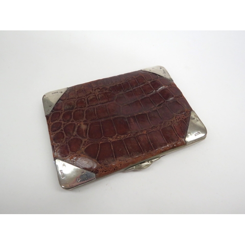 6389 - An Edwardian silver and crocodile skin wallet by Fred Taylor, London 1904, marked corner brackets 10... 