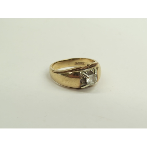 6390 - A 9ct gold ring set with central diamond 0.05ct approx, 5.4g