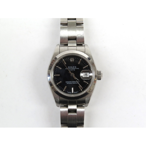 6398 - A Rolex Oyster Perpetual Date ladies wristwatch, stainless steel case and strap, black dial with bat... 