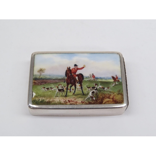 6399 - A silver match box by Howard James with an enamelled lid depicting Huntsmen on horses and pack of hu... 