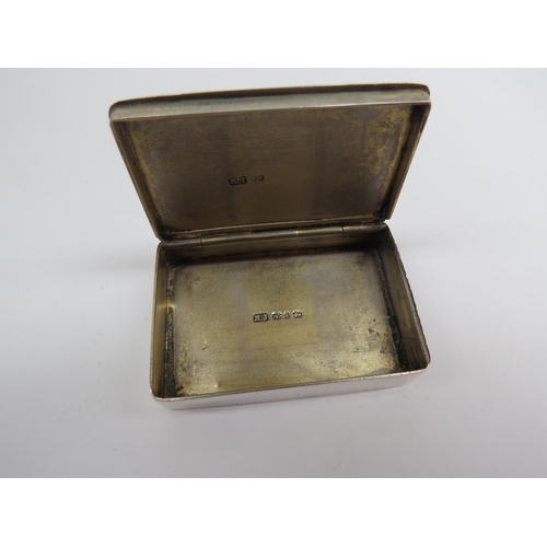 6399 - A silver match box by Howard James with an enamelled lid depicting Huntsmen on horses and pack of hu... 