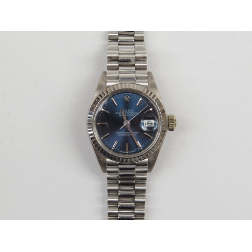 6401 - A Rolex Oyster perpetual Datejust ladies wristwatch on 18k white gold strap, blue dial with baton ma... 