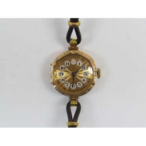 6403 - A 9ct gold lady's wristwatch with Arabic numerals, Swiss movement