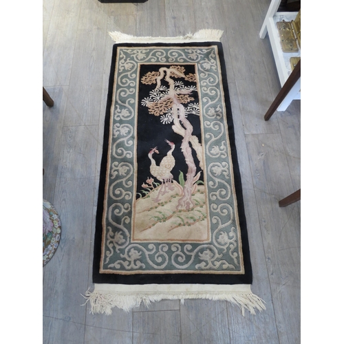 6453 - A 20th Century Chinese small rug crane and tree central field, 146cm x 68cm