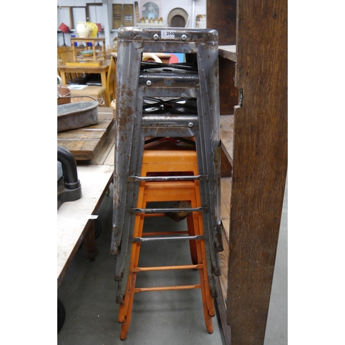 2014 - Five metal bar stools, two joined by a timber branch