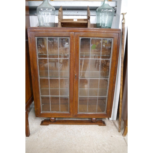 2127 - An Art Deco oak and glazed two door bookcase