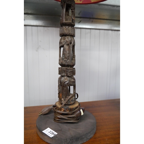 2429 - A pair of African carved lamps with shades