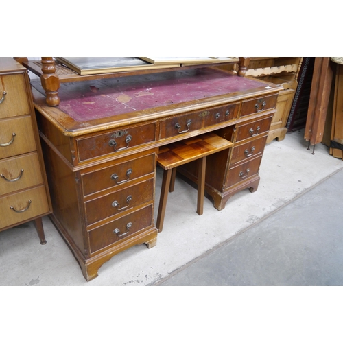 2408 - A reproduction yew wood twin pedestal desk, top a/f