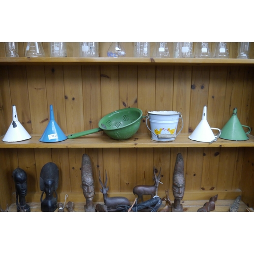 2329 - Six pieces of enamelware including sieve, funnels and bucket