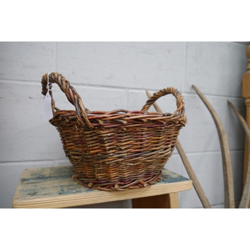 2330 - A small twin-handled wicker basket