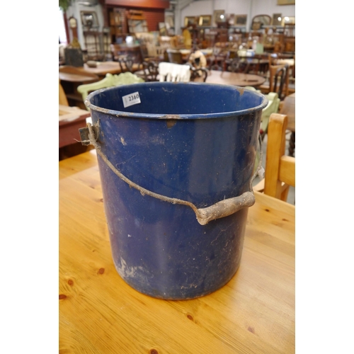 2029 - A blue enamel bucket, worm to handle