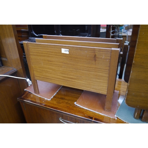 2437 - A 1970's teak magazine rack