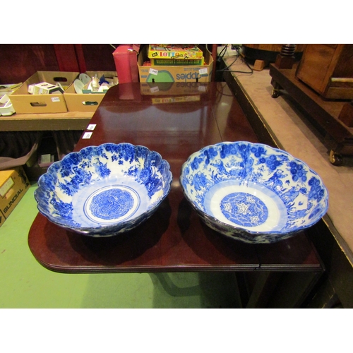 4004 - Two 20th Century Chinese blue and white scalloped-edge bowls with figural and floral design, both ap... 