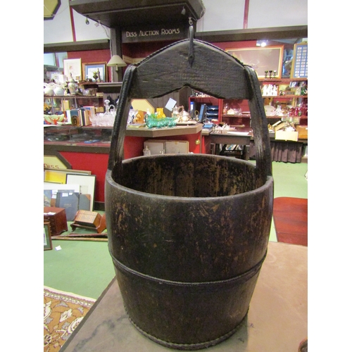 4007 - An Oriental wooden metal-bound well bucket, 60cm tall x 35cm diameter