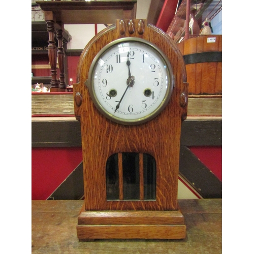 4010 - An early 20th Century oak cased mantel clock, 15