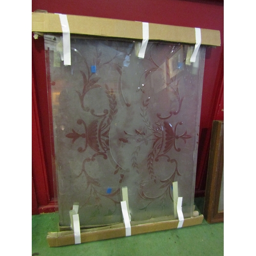 4020 - A pair of 1920's cut glass showman's wagon window panes, floral swag designs, each 62cm x 85cm appro... 