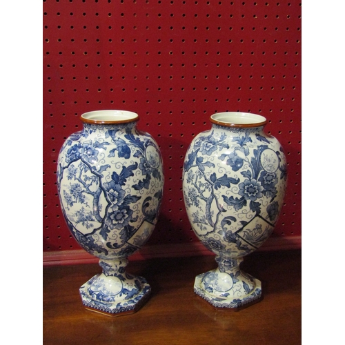 4026 - A pair of Dutch Delft vases with blue printed foliage decoration and panels of floral scenes. Faded ... 