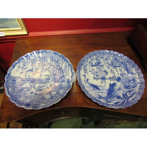 4027 - Four blue and white ceramic plates with frilled edges, scenes of flora and fauna, two with the same ... 