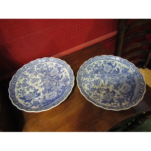 4027 - Four blue and white ceramic plates with frilled edges, scenes of flora and fauna, two with the same ... 