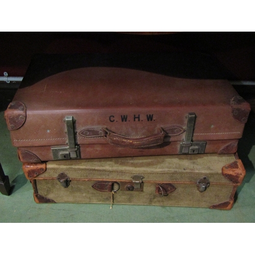 4029 - A vintage canvas suitcase containing Christmas decorations and a 