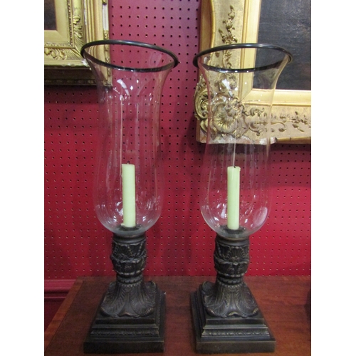 4036 - A pair of modern ornate metal based storm lantern style candle holders with large glass shades, 50cm... 