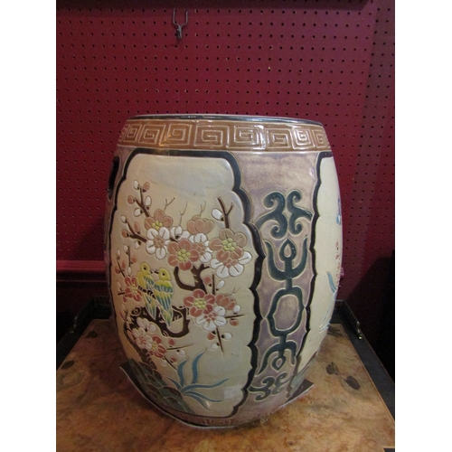 4050 - A modern Chinese ceramic drum-form seat, panels depicting birds and butterflies among flowers, 39cm ... 