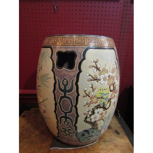 4050 - A modern Chinese ceramic drum-form seat, panels depicting birds and butterflies among flowers, 39cm ... 