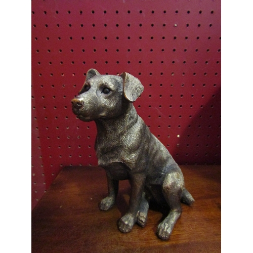 4054 - A bronzed figure of a seated dog, 15cm tall