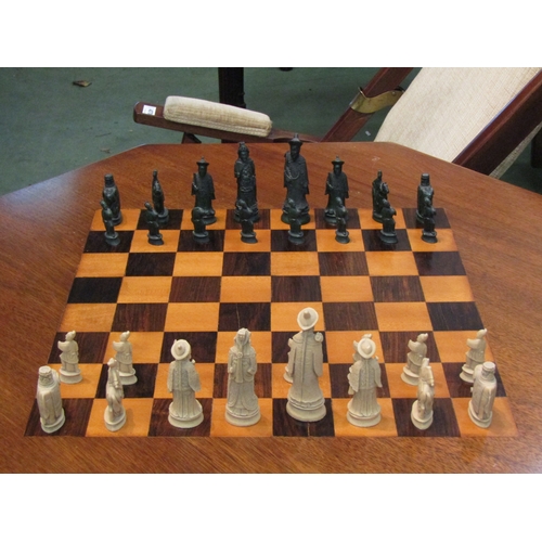 4071 - An octagonal-top chess table on cabriole legs with pieces, three pieces a/f