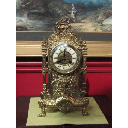 4084 - An ornate brass mantel clock, 14