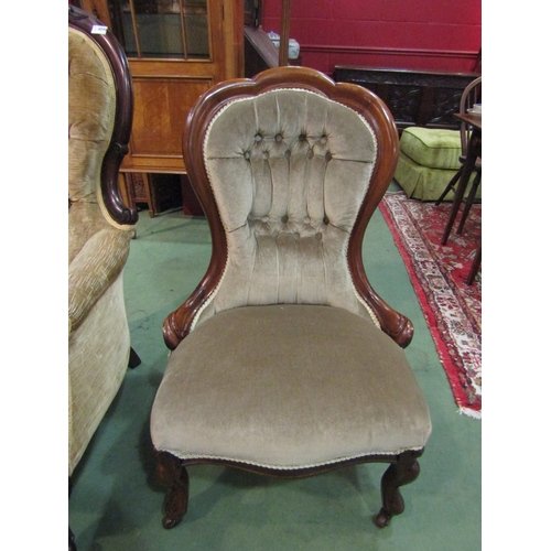 4099 - A mid-Victorian walnut armchair, the shaped top button backrest over a serpentine front seat and car... 