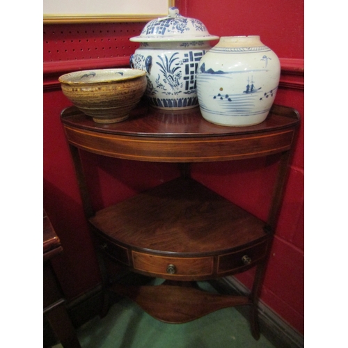 4119 - A George III mahogany and satinwood line inlaid three tier corner washstand with central single draw... 